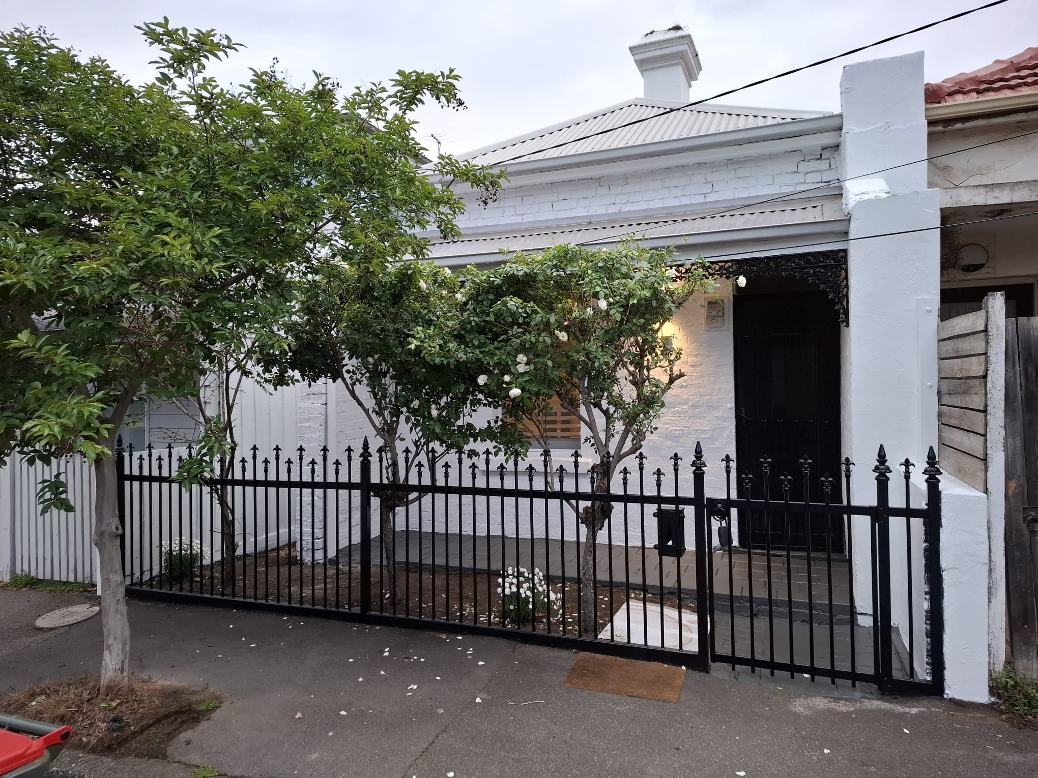 Painted heritage building in Melbourne with original brickwork and decorative details