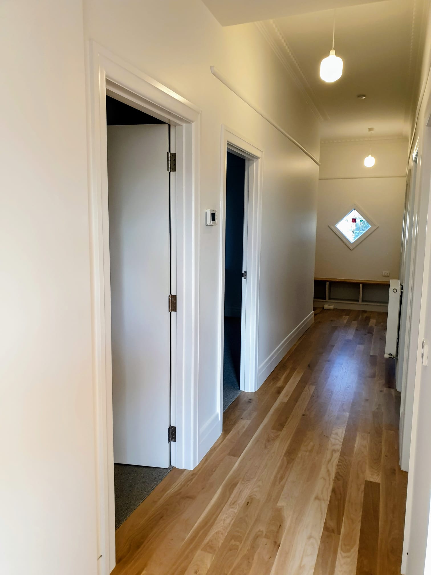 Freshly painted Clifton Hill hallway with clean walls and detailed trim