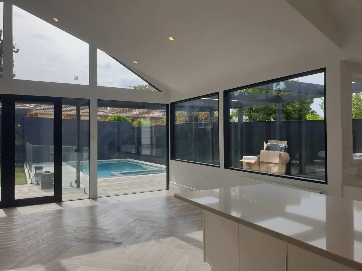 Completed light-filled interior with painted walls and a high ceiling