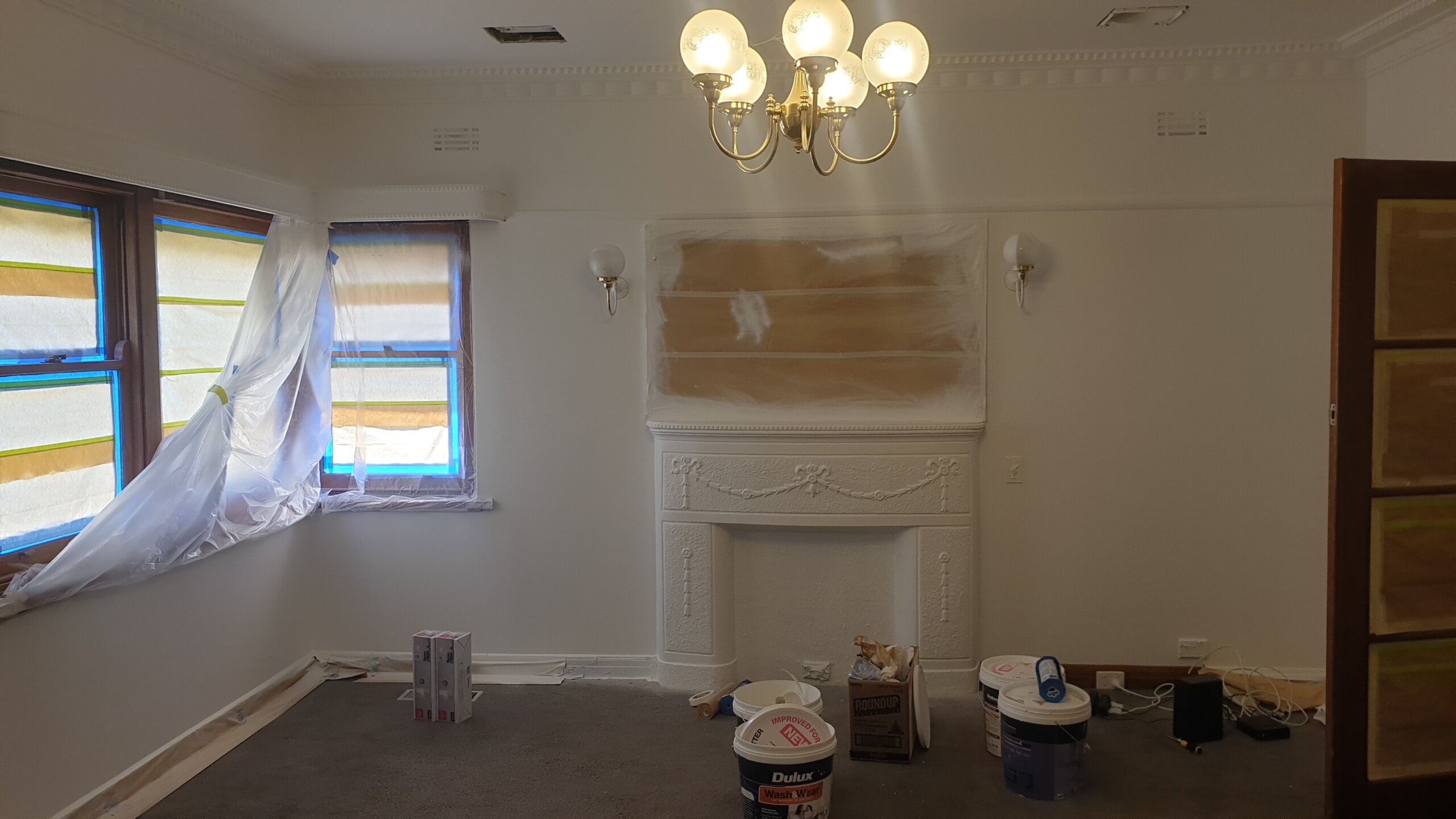 Interior wall preparation around a heritage fireplace