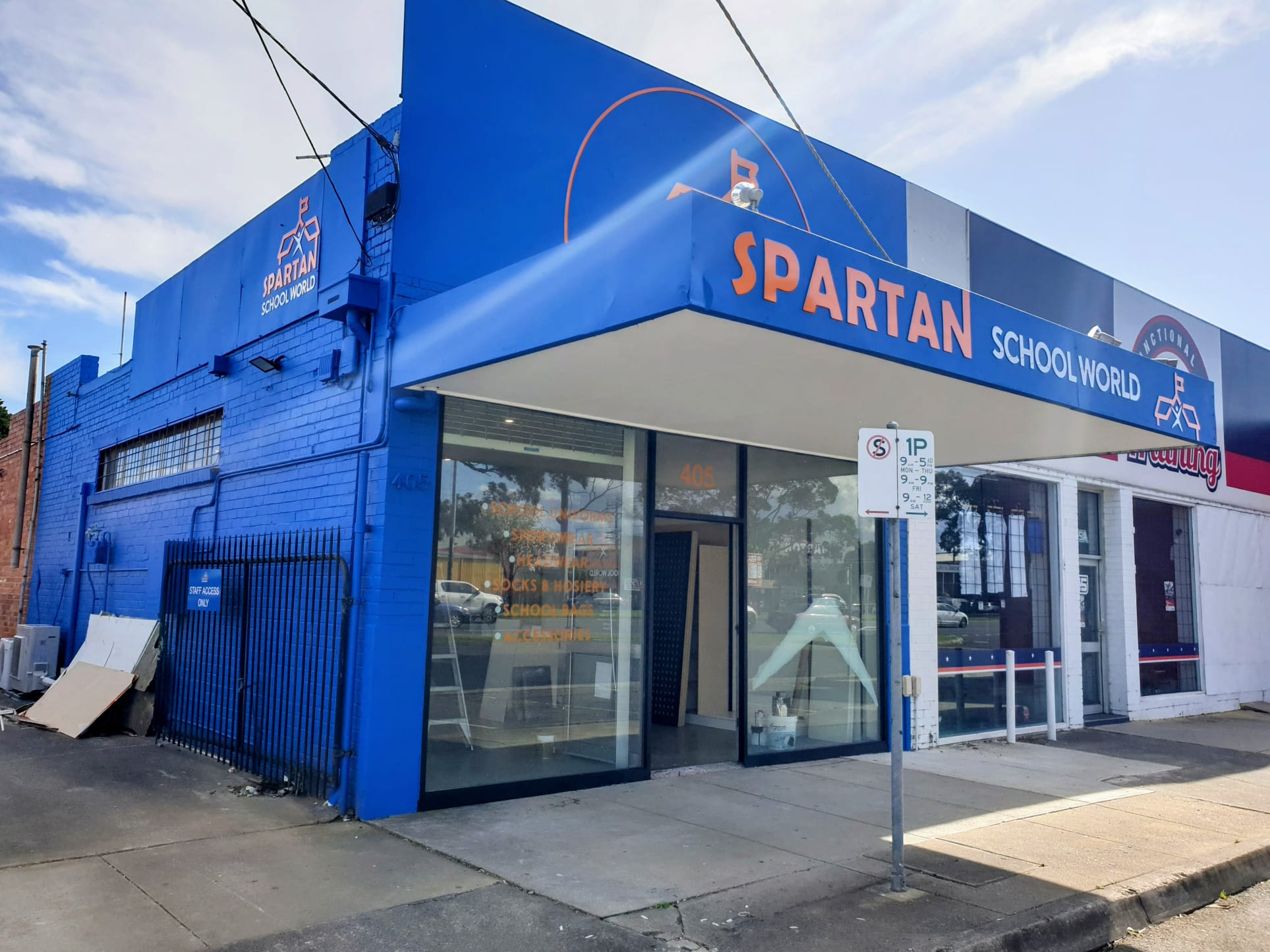 Painted commercial shopfront in blue and white