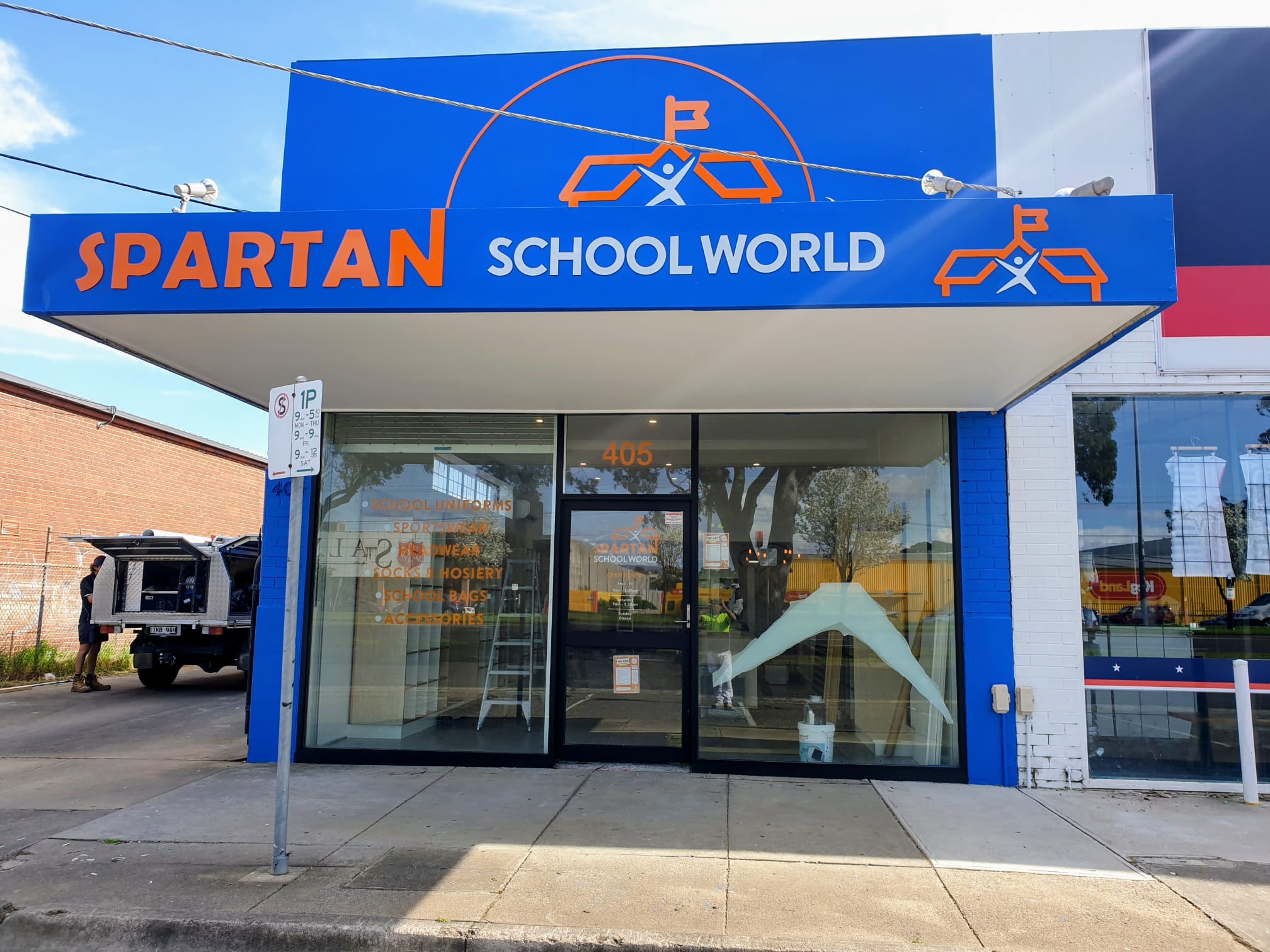 Painted shopfront with blue facade and retail signage