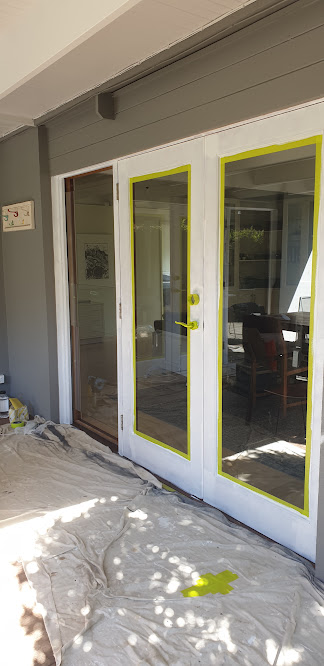 Exterior door painting with surrounding surfaces protected