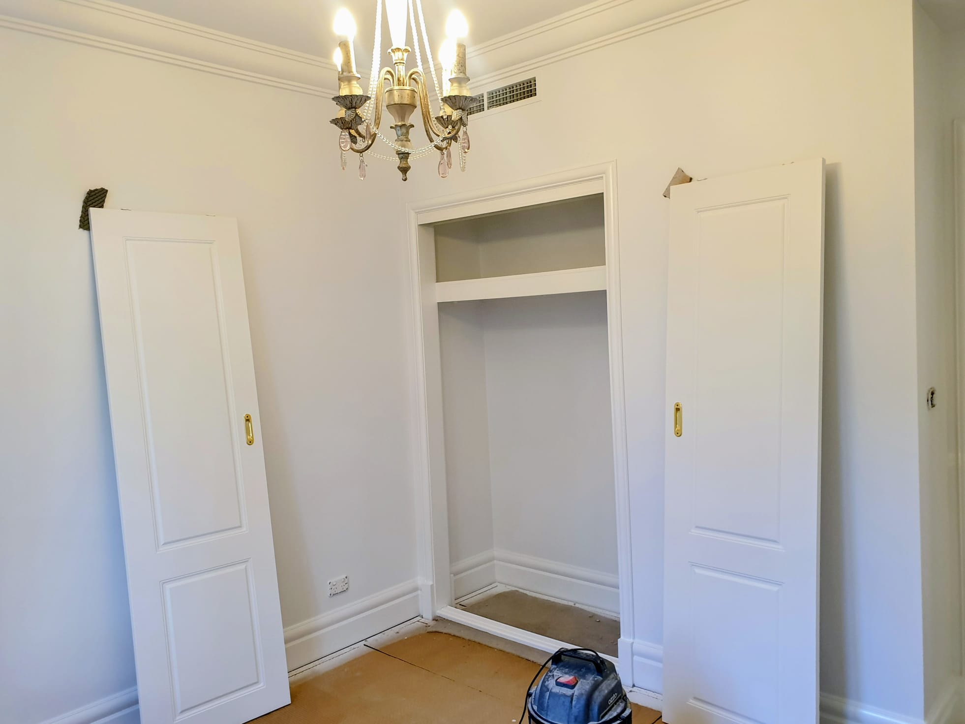 Interior room repainting with freshly painted walls and trim